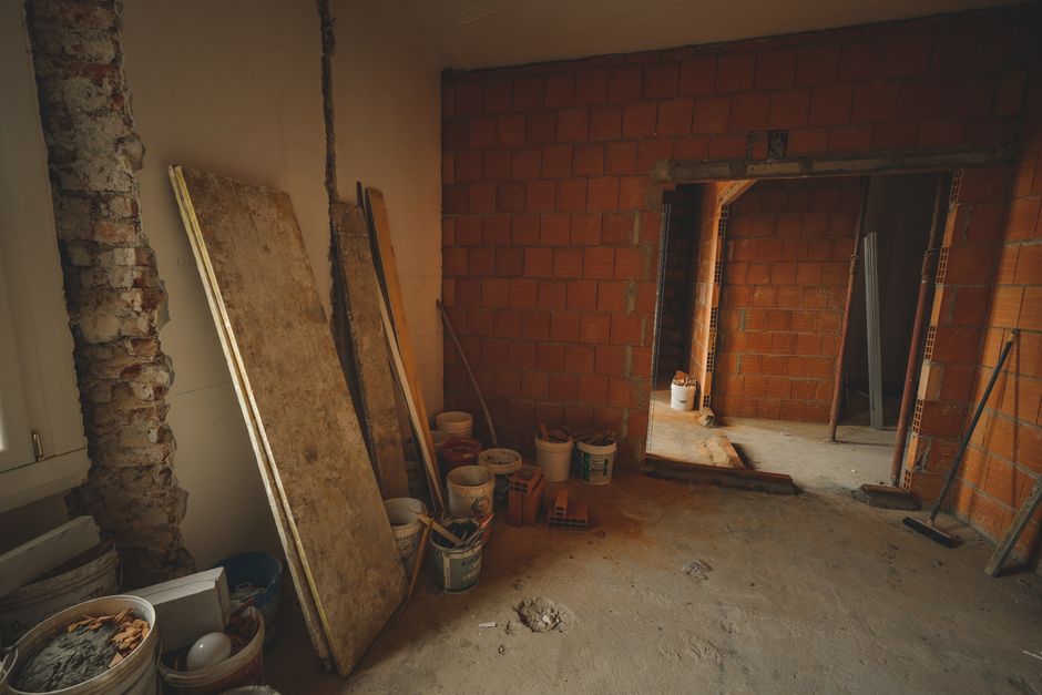 Home renovation construction site showing a large structural addition